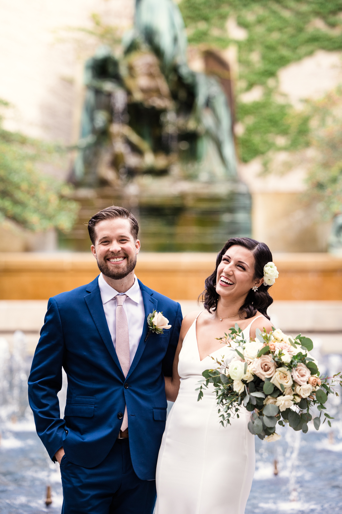 Candid photo of bride and groom in the Art Institute of Chicago gardens before September elopement