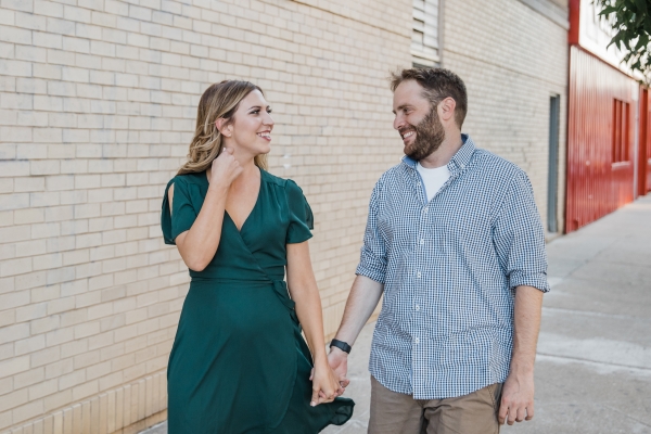Couple holding hands and laughing