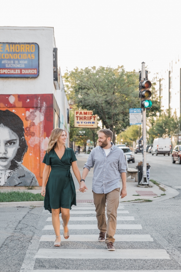 Couple holding hands and crossing street