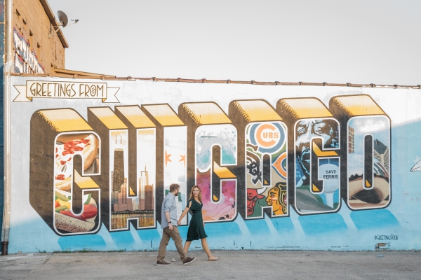 Couple in front of Chicago mural