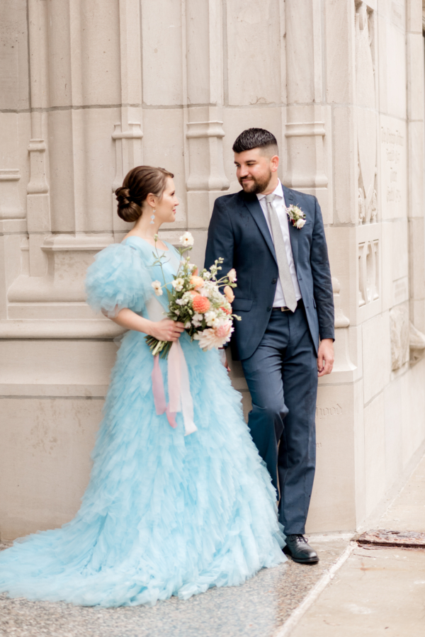 Blue Ruffles and Peach Flowers in Striking Elopement